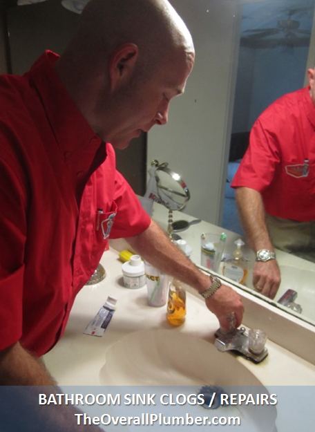plumber-repairing-a-bathroom-sink-faucet-leak